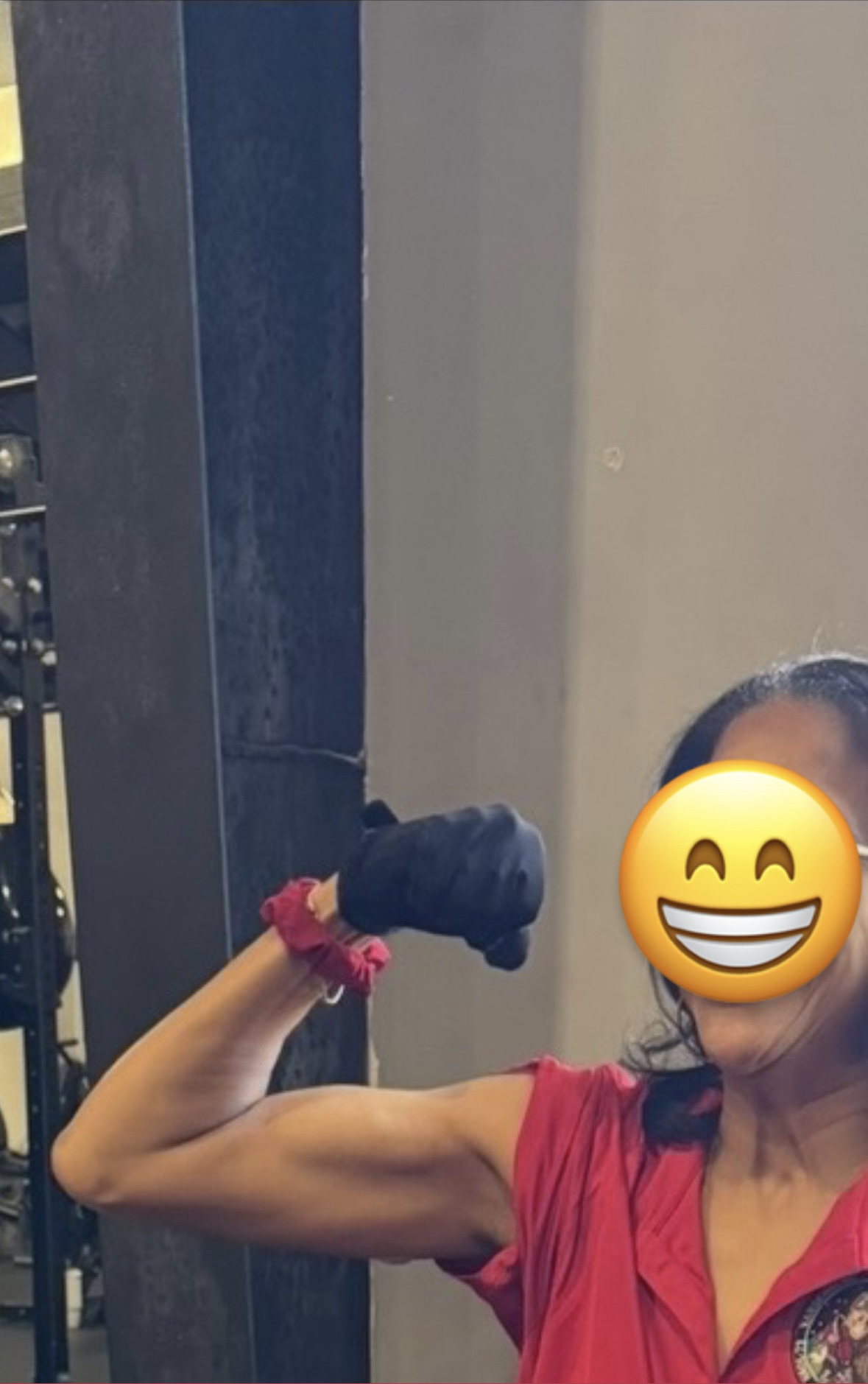 Karolyn flexing after training with Sports Bra Strength